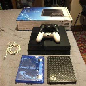 PS4 console with games and controllers